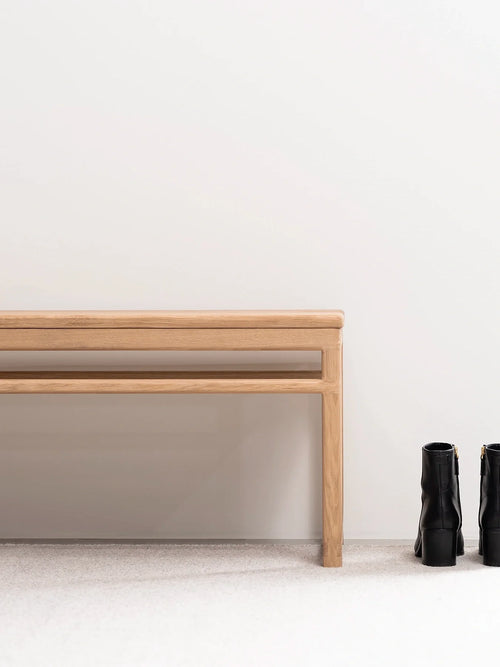 Wooden Bench Alva in natural oak frame against a minimalist wall, perfect for entryways or contemporary interiors.